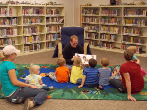 Children's librarian Chris reads a story at storytime on October 14, 2016.