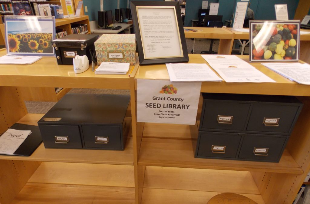 The files and paperwork for the Grant County Seed Library sit on shelves near the public library's information desk.