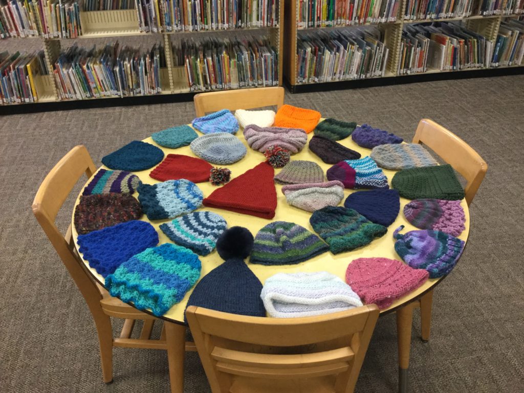 knit hats to be distributed to children at storytime, December 2018