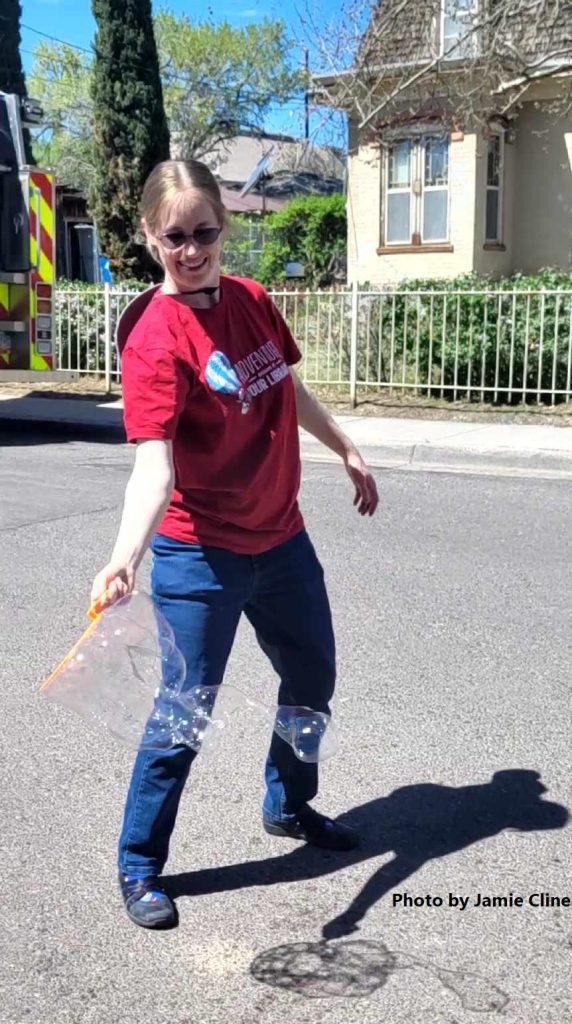 library staff member making bubbles